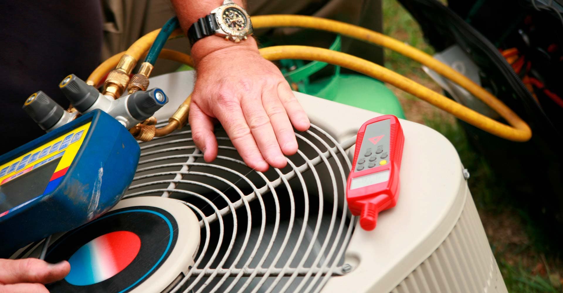 HVAC technician servicing air conditioning equipment